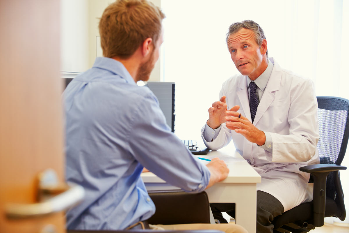 Male Patient Having Consultation With Doctor In Office | What Is Leaky Gut Syndrome And How Does It Affect Your Health?