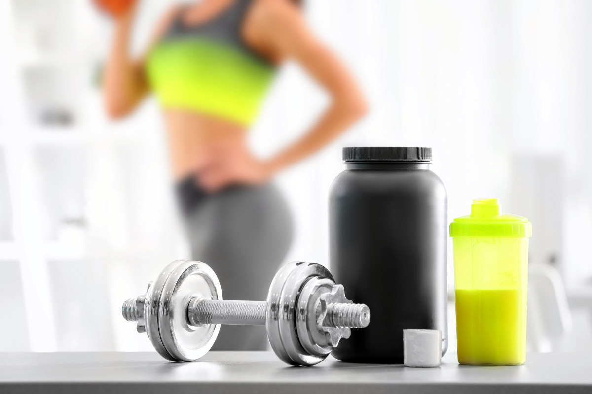 protein shake and blurred woman on background | What Is A Branched Chain Amino Acid (BCAA) And How Does It Help The Body? | bcaa
