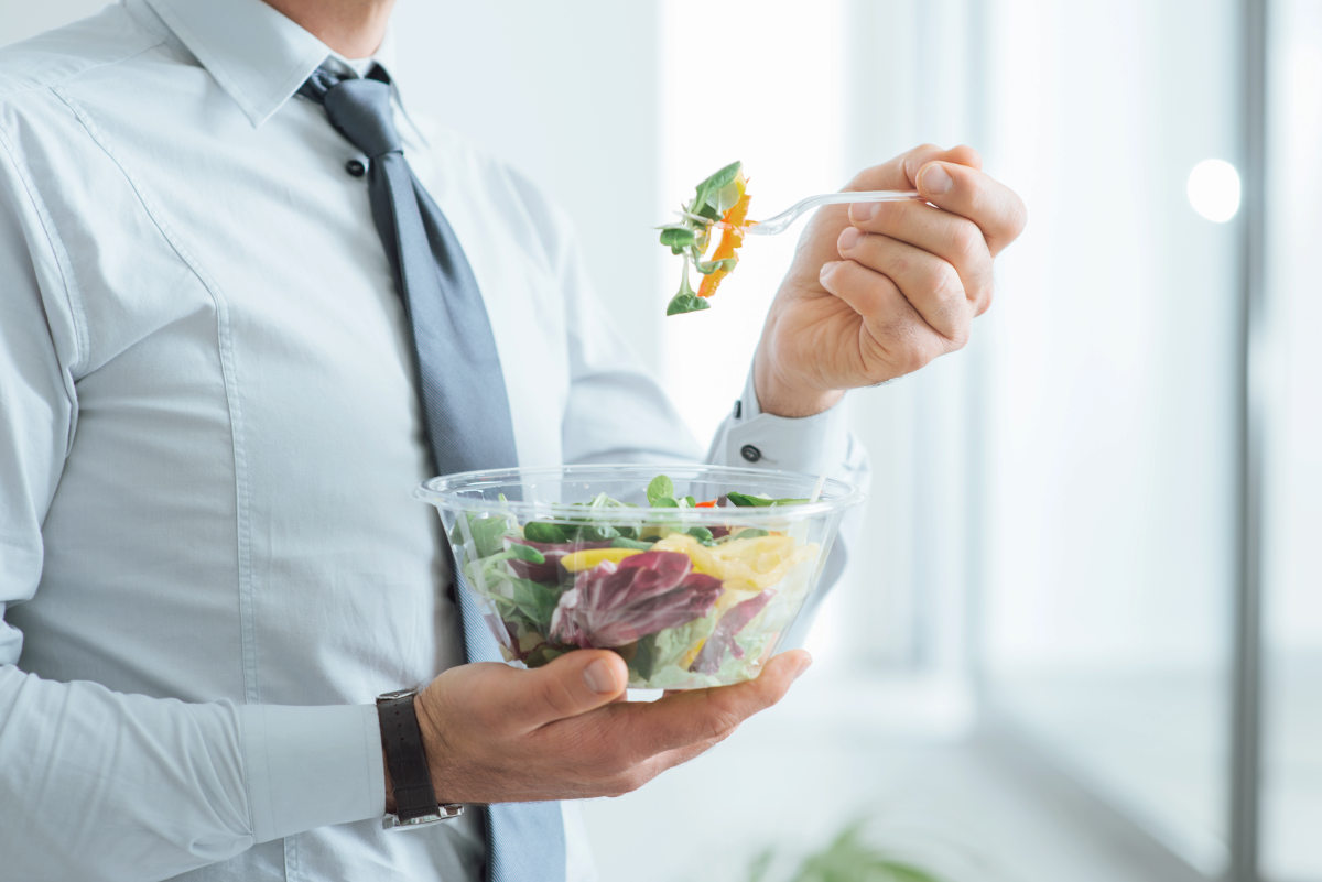 Businessman having a vegetables salad for lunch | Foods To Add To Your Microbiome Diet