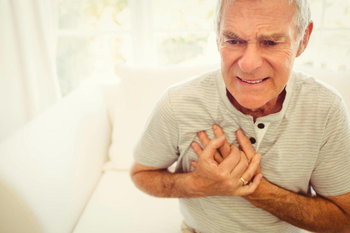 Senior man with pain on heart in bedroom | Risks Of High TMAO And How To Reduce TMAO Levels