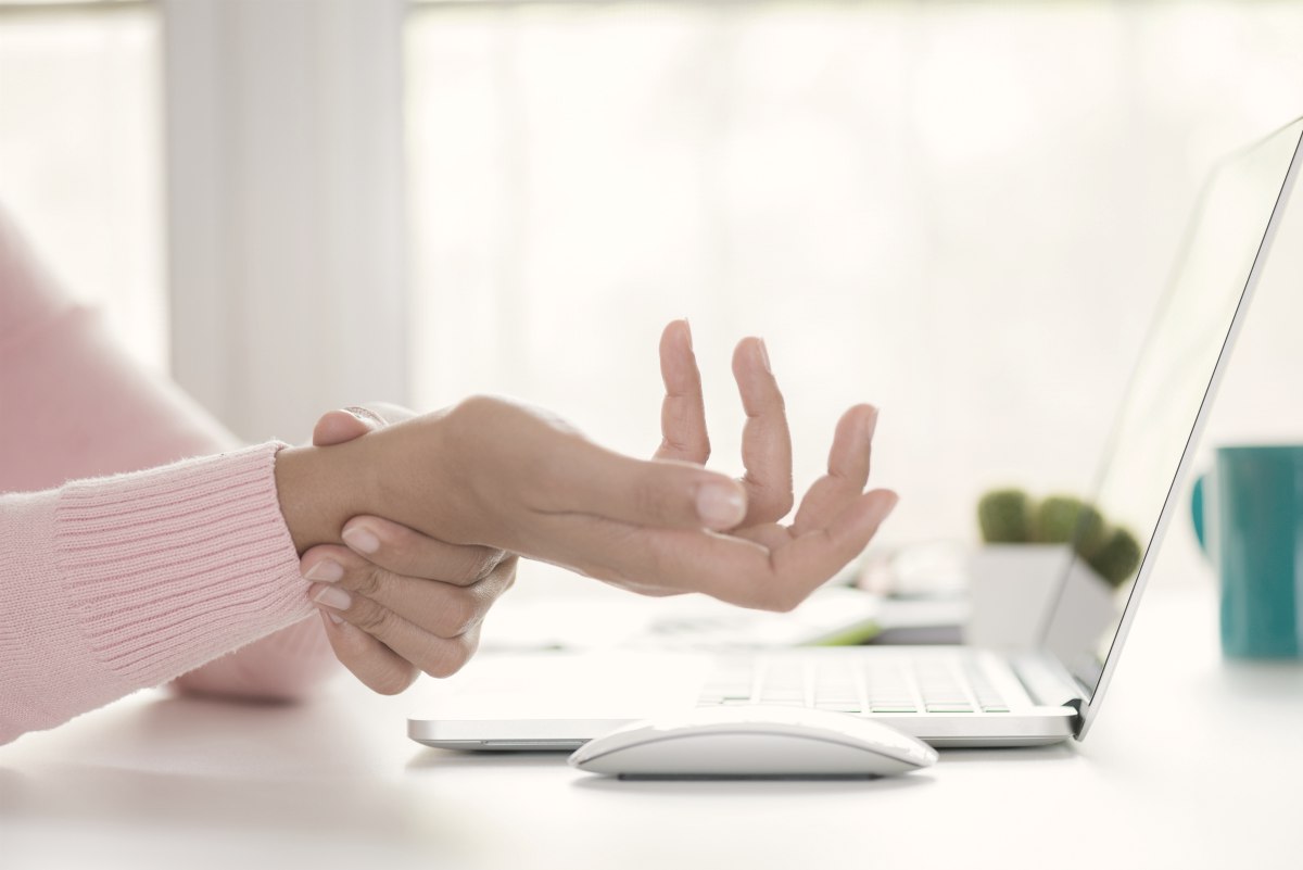woman holding her wrist | Mysterious Wrist Pain Symptoms, Causes, and Treatment | ulnar wrist pain
